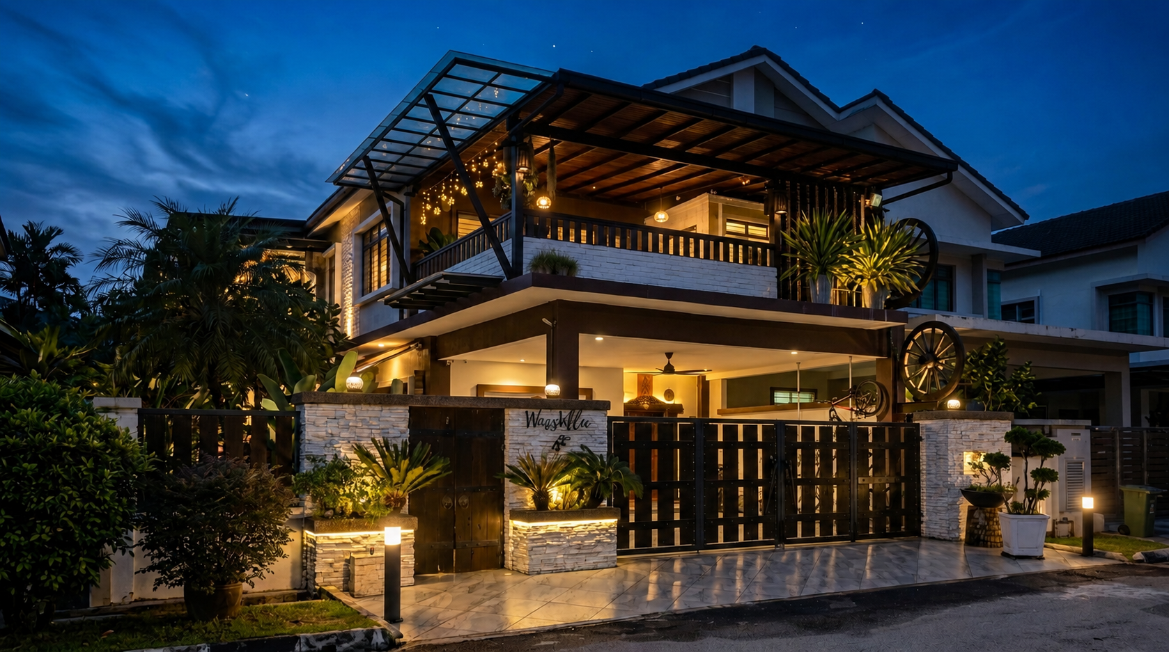 Winss Enterprise signature bungalow renovation in Chemor, Perak — Bali-inspired timber and stone facade at dusk